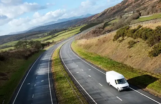 Van driving on a dual carriageway